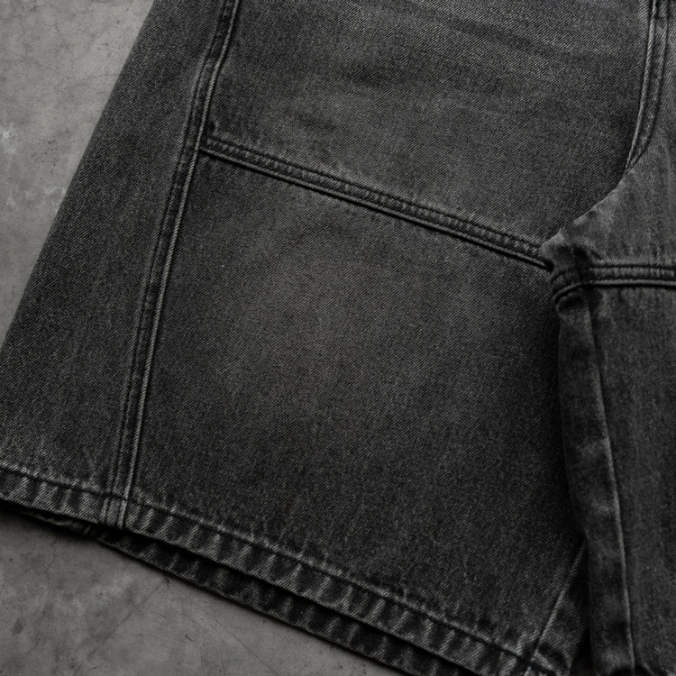 8W PANEL BAGGY JORTS BLACK — concrete front detail